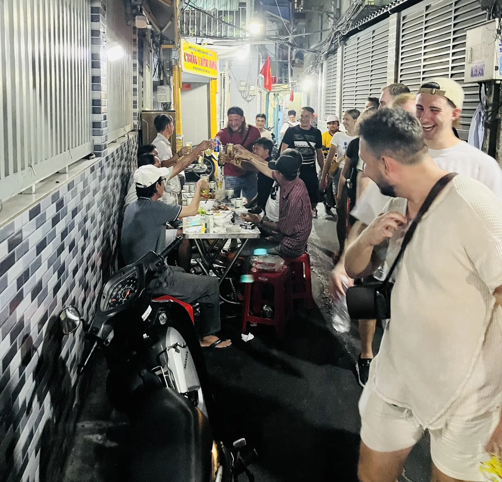 Travelers interacting with local people in Saigon