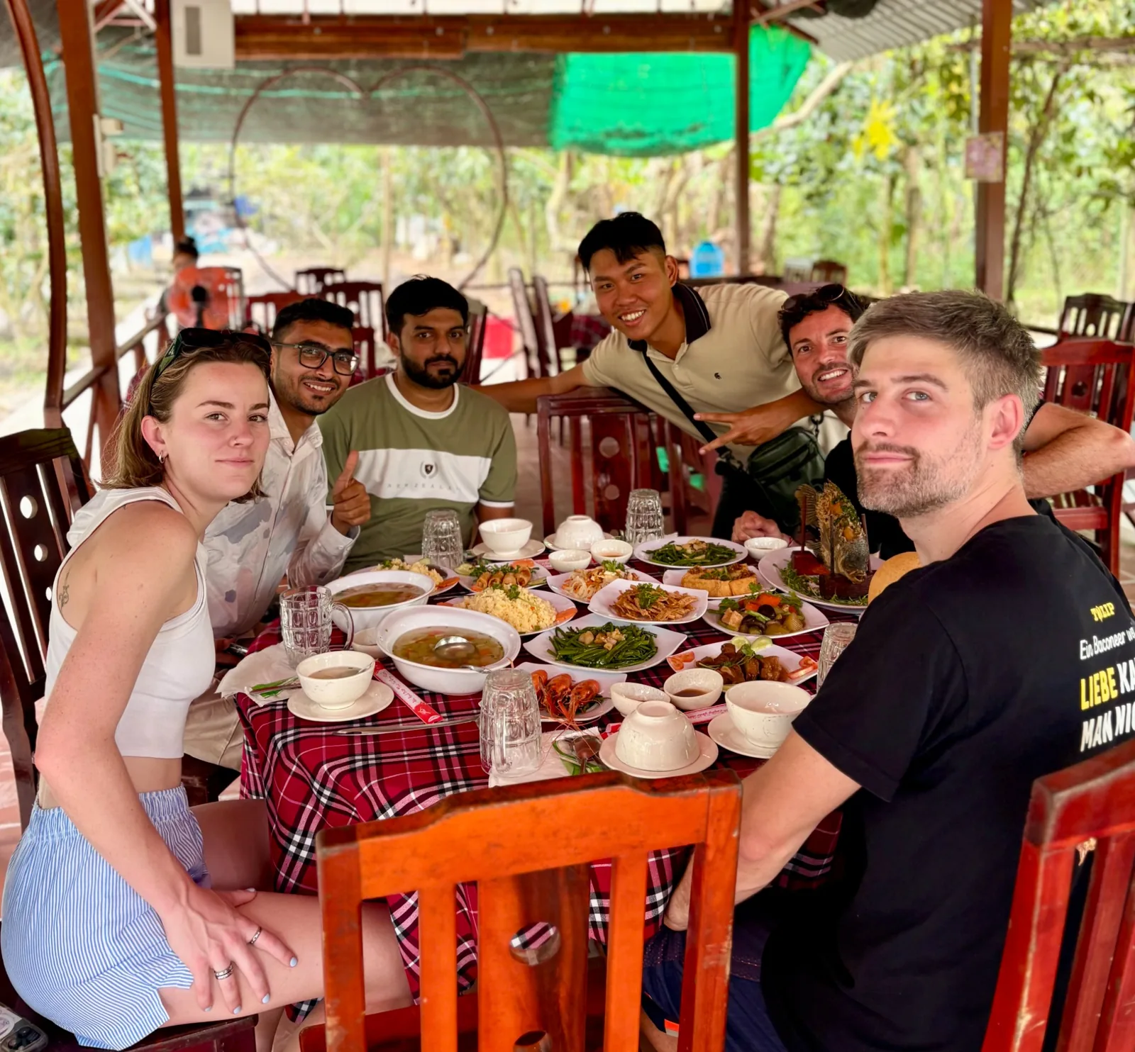 Travelers sharing a meal on a custom OG Saigon day